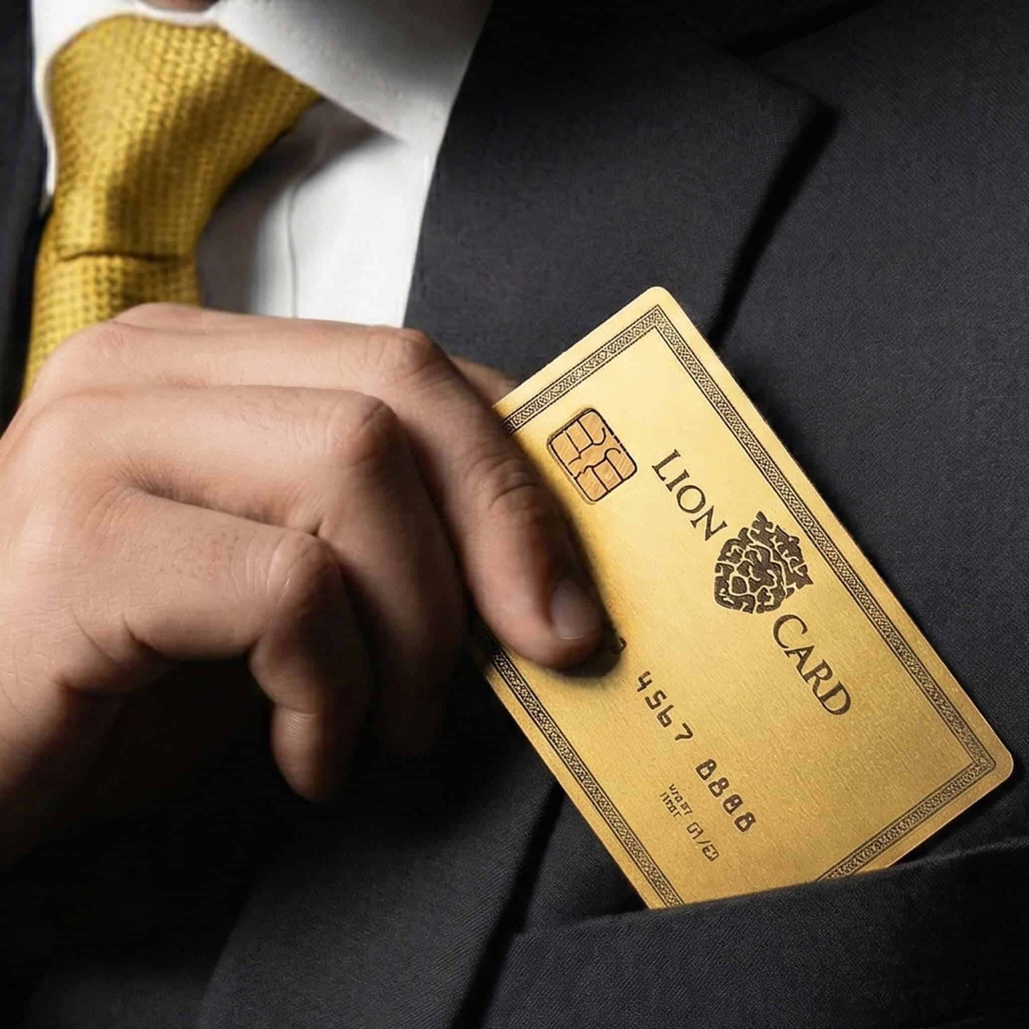 Luxury gold lion card in a man's suit pocket, representing high-value credit or membership card, symbolizing prestige, financial strength, and exclusive access.