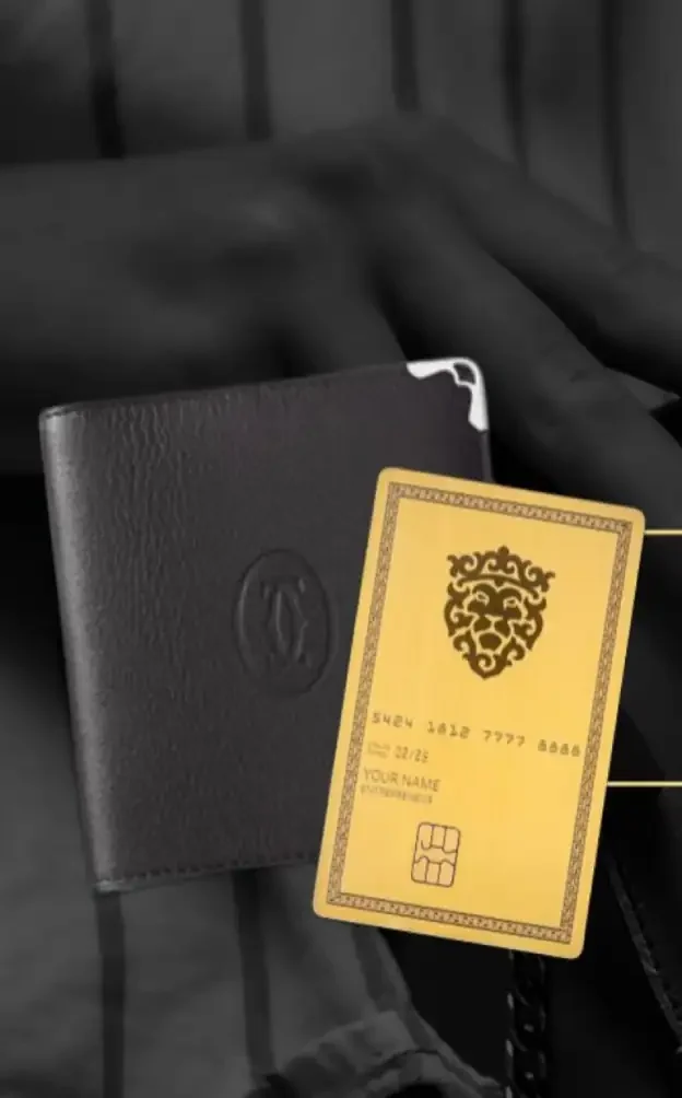 Luxury lion-themed business card with gold accents and embossed logo, paired with a black leather wallet for sophisticated branding and networking purposes.